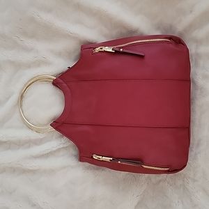 INC red handbag